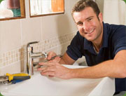 Plumber at sink